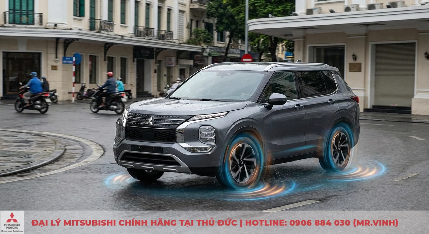 Xe SUV Mitsubishi m&agrave;u x&aacute;m cua tr&ecirc;n đường ướt, thể hiện c&ocirc;ng nghệ c&acirc;n bằng v&agrave; kiểm so&aacute;t chủ động qua hiệu ứng b&aacute;nh xe